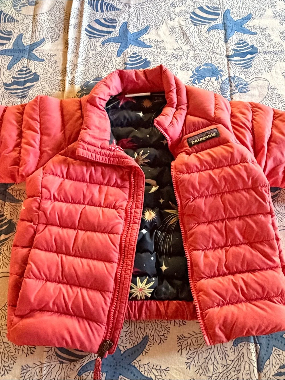Patagonia Kids Coral Pink Puffer Jacket with Navy Starfish Lining